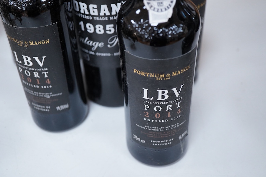 Seven assorted ports including Morgan’s 1985 and three half bottle Fortnum & Mason, together with two Madeira wines and a half bottle of Champagne.